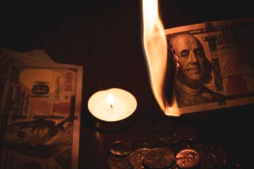 Burning a hundred dollar bill